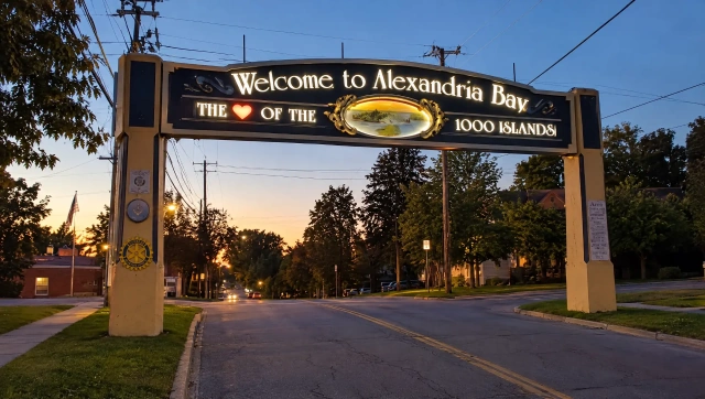 Welcome to Alexandria Bay sign at dusk near the Thousand Islands Millionaires Row Tour